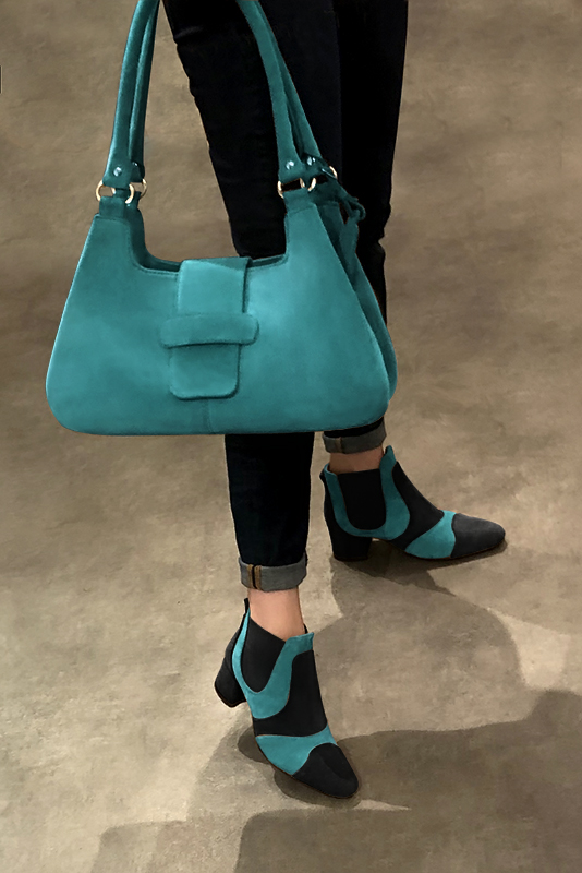 Matt black and aquamarine blue women's ankle boots, with elastics. Round toe. Low flare heels. Worn view - Florence KOOIJMAN